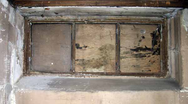 Stripped cellar window