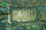 St. Peter's marker, set into the wall of Riverside Walk (formerly Bridge Street). This is the only known surviving marker for the parish of St Peter