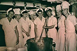 Stirring the Christmas Pudding, December 1955. From left to right: Ck Morrisey, Mne Ck Whitehead, Ck Jenkins, P.O. Ck Ford, P.O. Ck Bennet, Cdr Trythall, C.P.O. Ck Heath, P.O. Ck Newell. Photo kindly supplied by Paul Stanley.