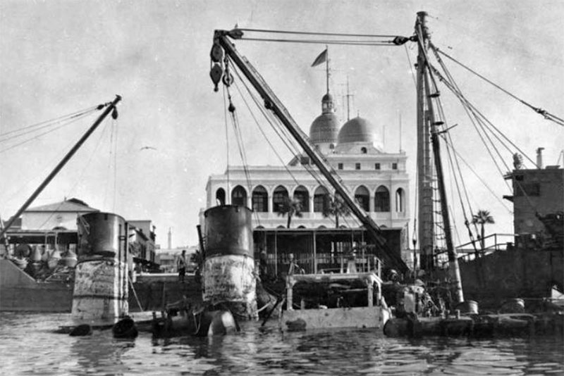 LCT 525 alongside the wreck of the Tug Hercule. Port Said