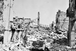 The main street of Zante, almost impassable following the earthquake. 99% of the dead were in this area. Anti-looting patrols were unnecessary here because of the devastation. One of the Royal Marine demolition party can be seen, August 1953. Image from Imperial War Museums, A32669