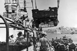 At Malta the Royal Navy hastens to load ships with all types of relief equipment, August 1953. Image from Imperial War Museums, A32688