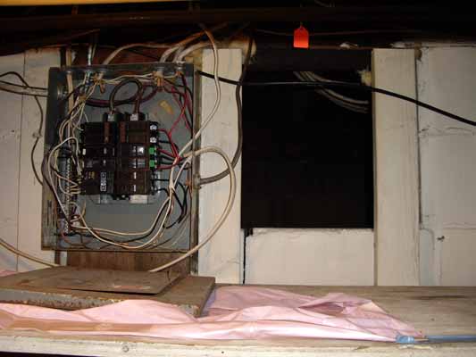 Entrance to kitchen crawlspace