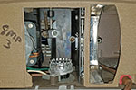 Technicolor Instant Movie Projector 500 with rear panel removed to show the lamp holder and cartridge slot.
