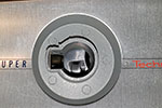 Unscrew the lens from the body and clean the hole left and surrounding areas of the body.