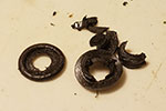 The discarded original grommets.