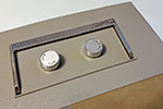 The knobs on top of the projector have to be removed. Turn the "Frame" knob anticlockwise and it will unscrew. The on/off knob simply pulls off. If it is tight then it can be prised off with a screwdriver - protect the body of the projector when doing this.