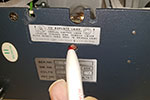 To remove the bulb wear gloves or use a cloth and hold the lamp. On the underside of the projector, under the lamp is a small hole. Push a pencil into the hole and push against the bottom of the lamp with a steady pressure until it is free of its holder and remove it from the projector.