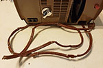 An 800 projector. The electrical cord probably got into this state by being wound up inside the projector and being stored somewhere very warm for an extended period of time.