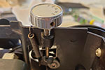 Correct positioning of the bottom of the frame adjustment knob on top of the plate on the aperture plate arm.